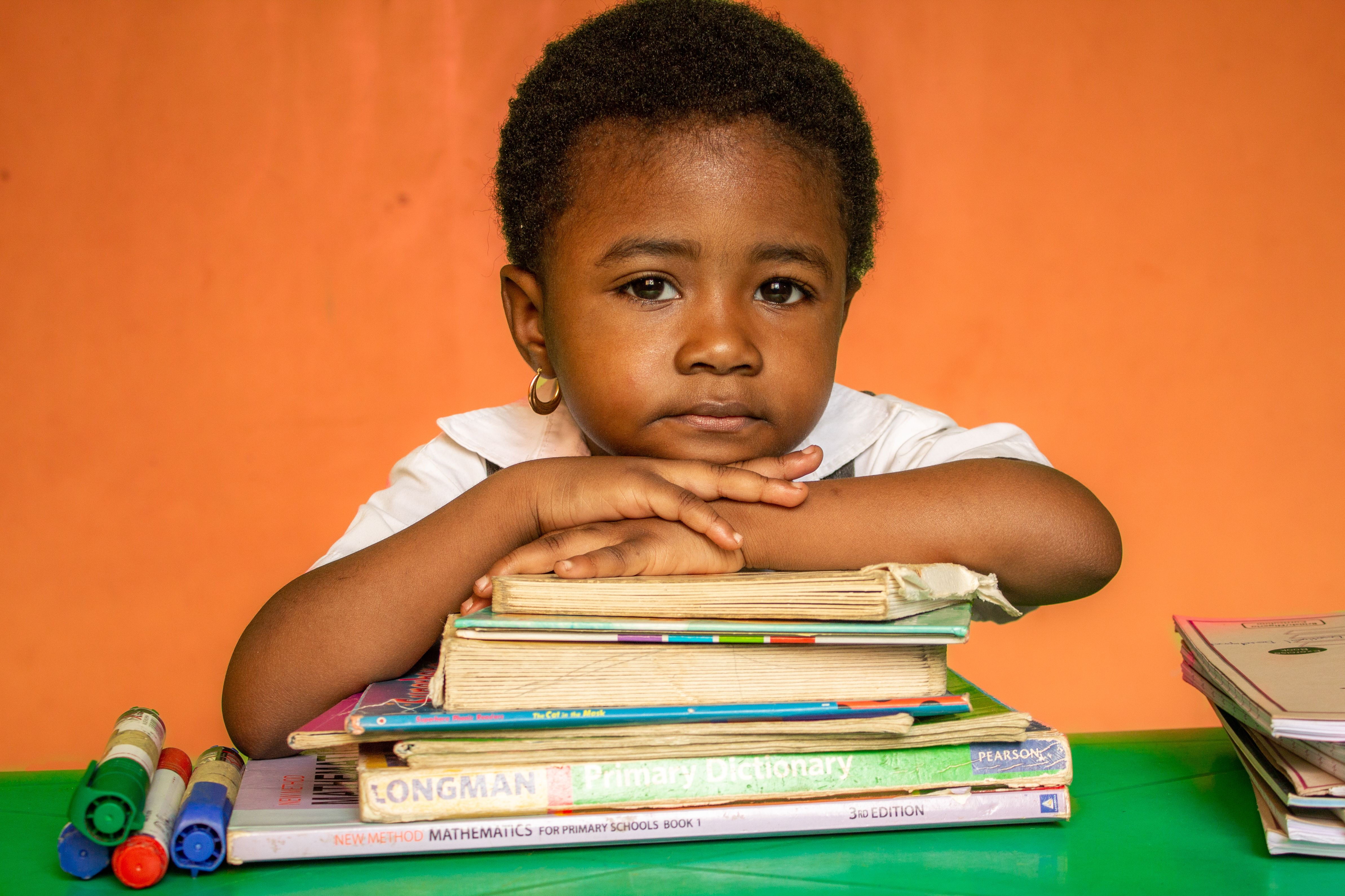 KELP student with her school books